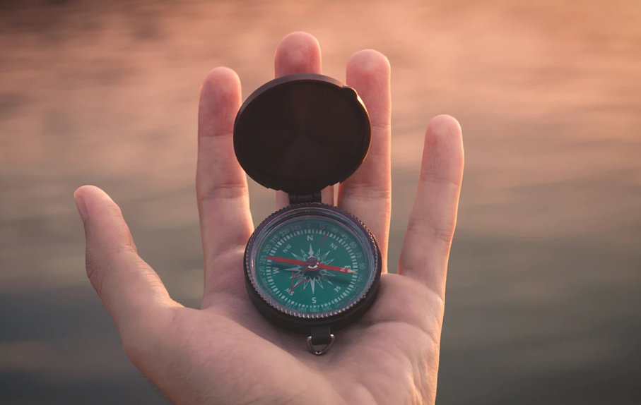 a man hand with a compass