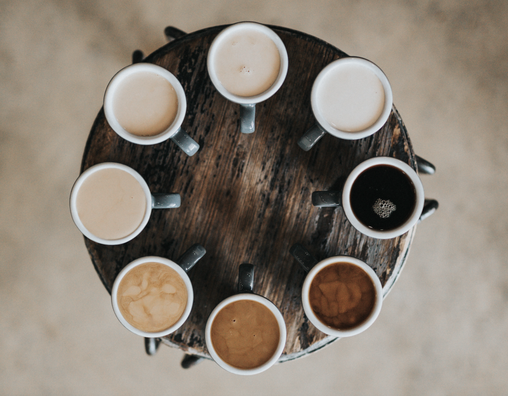 different coffies on a wooden table