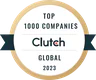 Round badge with gold trim reading Top 1000 Companies, Clutch, Global 2023 in black and gold text, indicating a recognition or award from Clutch for top global companies in 2023.