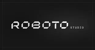 The image displays the words ROBOTO STUDIO in a bold, geometric, futuristic font on a dark background. ROBOTO is larger and more prominent, whilst STUDIO appears smaller to the right.